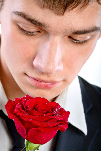 Man smelling a rose - Φωτογραφία, εικόνα