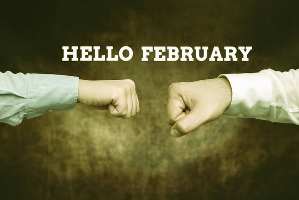 Podpis wyświetlający Hello February. Conceptual photo greeting used when welcoming the second month of the year Two Professional Well-Dressed Corporate Businessmen Handshake Indoors - Zdjęcie, obraz