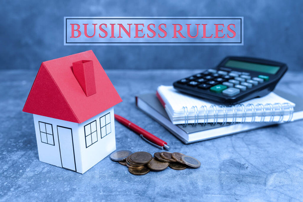 Writing displaying text Business Rules. Concept meaning the principles which determine the corporation s is activities Creating Property Contract To Sell, Presenting House Sale Deal - Foto, Bild