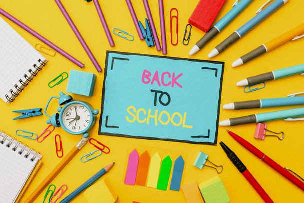 Inspiration showing sign Back To School. Business overview is the period relating to the start of a new school year Flashy School And Office Supplies Bright Teaching And Learning Collections - Foto, imagen