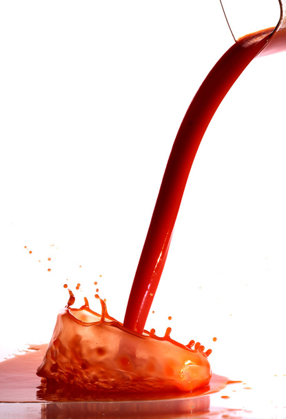 Tomato juice splash in glass white background - 写真・画像