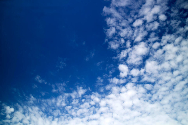 Photo shoot of the composition of the clouds in a blue sky  - Фото, изображение