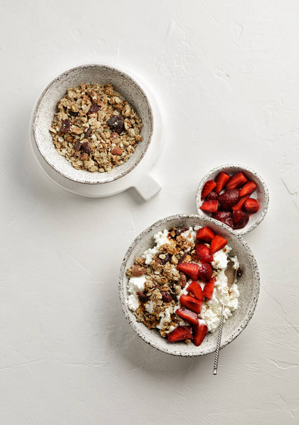 cottage cheese with strawberries and granola  - 写真・画像