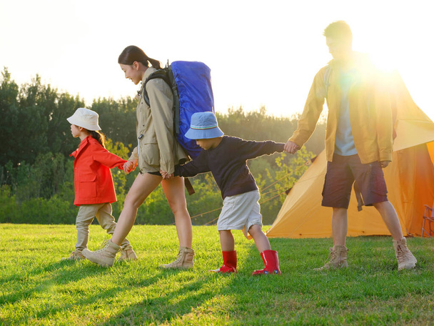 A Happy family of four outdoor hiking - 写真・画像