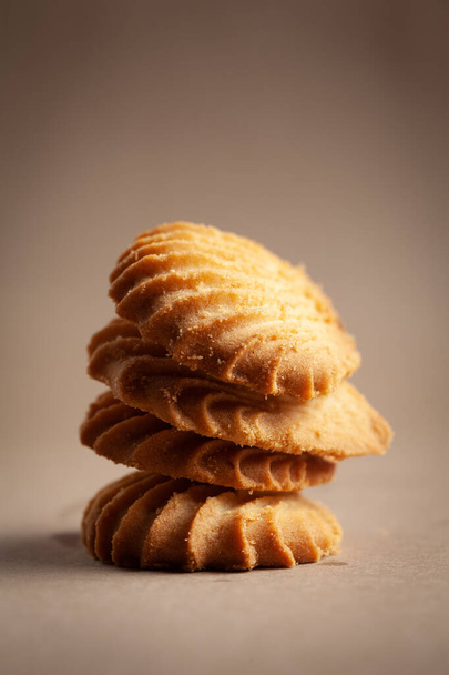 Close-up of stacking delicious freshly microwave oven baked simple cookies or biscuits. - Foto, afbeelding