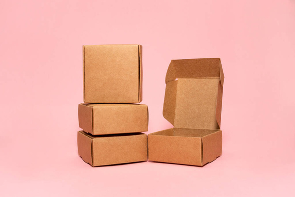 Self-gathering cardboard box. Delivery, moving, gift wrapping on a colored background. Place for text and logo. Brown. - Photo, Image