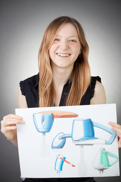 Young Design Engineer Woman Shows a Screwdriver Design Plan - Photo, Image