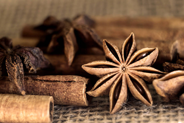 cinnamon sticks and star anise on burlap close-up. Photo. macro - Photo, Image