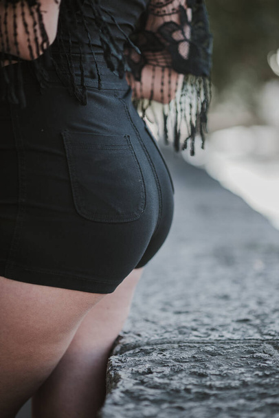 A closeup shot of a female with a sexy booty - Фото, изображение