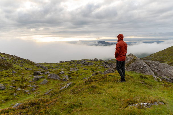 A Caucasian man from Ireland hiking in mountains - Valokuva, kuva