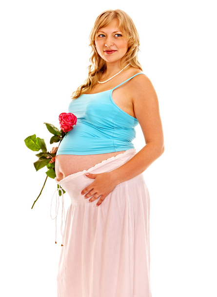 Pregnant woman with flower. - Photo, Image