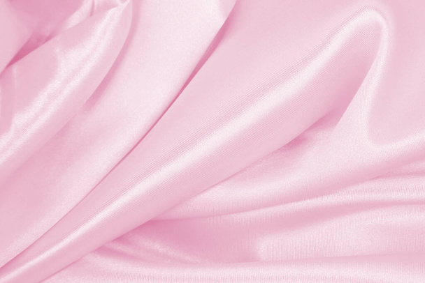 Smooth elegant pink silk or satin texture can use as wedding background. Luxurious background design - Фото, зображення