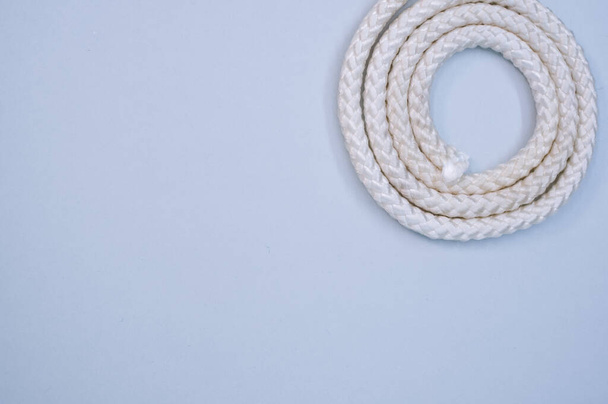 A closeup shot of a rope on a blue surface - copy space - 写真・画像