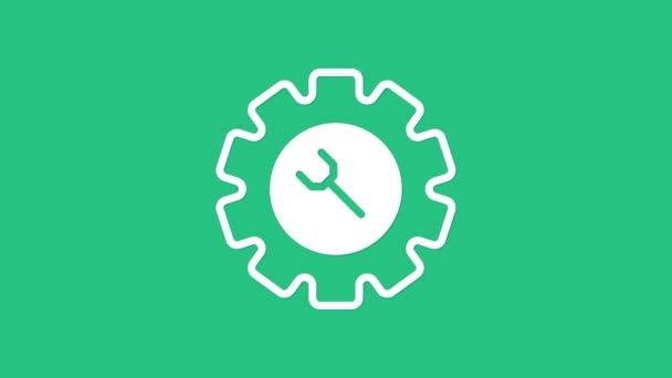 Weißer Schraubenschlüssel und Getriebesymbol isoliert auf grünem Hintergrund. Anpassung, Service, Einstellung, Wartung, Reparatur, Reparatur. 4K Video Motion Grafik Animation - Filmmaterial, Video