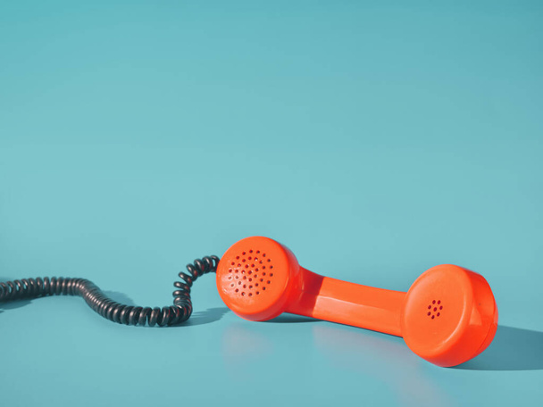 old phone and retro telephone on blue pastel background - Foto, afbeelding