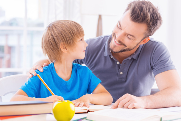 Father helping his son with homework - Photo, image