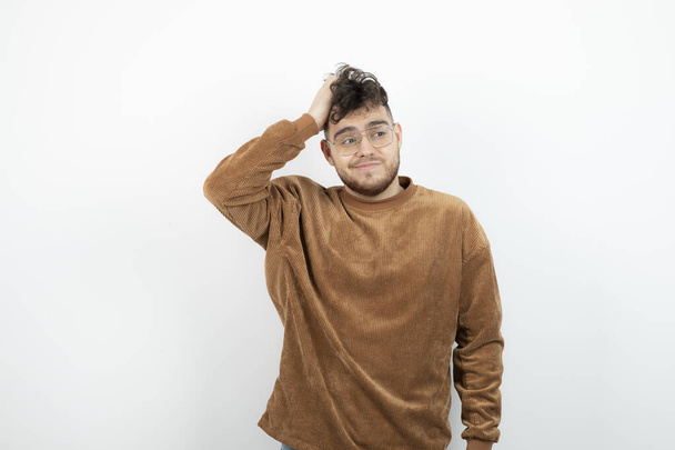 Photo of young handsome man in glasses standing and posing. High quality photo - Photo, Image
