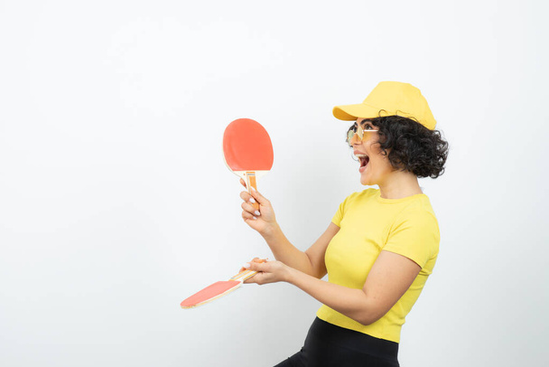 young woman posing with tennis rackets on white background  - Photo, Image