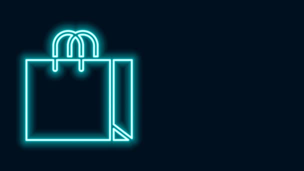 Gloeiende neon lijn Shopping bag sieraden pictogram geïsoleerd op zwarte achtergrond. 4K Video motion grafische animatie - Video