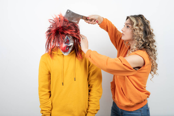 Wavy-haired woman standing near brunette guy with masque . High quality photo - Photo, Image