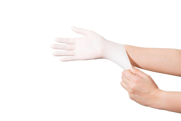 Doctor or nurse wearing gloves to care for a patient, white background - Photo, Image