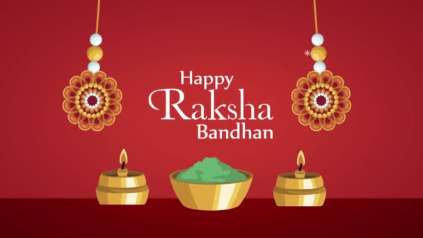 felice raksha bandhan lettering con braccialetti appesi e candele - Filmati, video