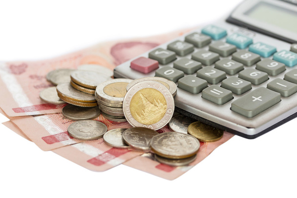 Calculatrice et pièces sur billets de banque thaïlandais
 - Photo, image