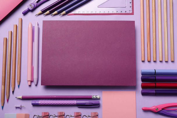 Flat lay composition with different stationery on violet background - Φωτογραφία, εικόνα