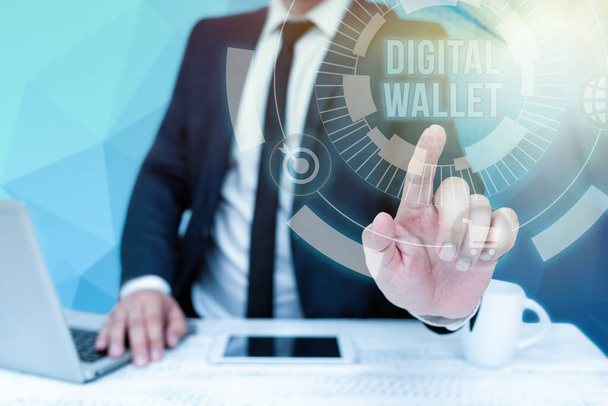Conceptual caption Digital Wallet. Word Written on a financial account that allows creating an online transaction Bussiness Man Sitting Desk Laptop And Phone Pointing Futuristic Technology. - Zdjęcie, obraz