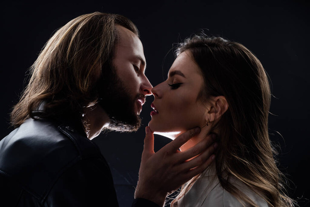 so tender. kissing. couple in love. fashionable couple closeup face portrait. - Foto, afbeelding