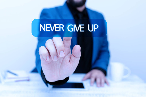 Sign displaying Never Give Up. Word for be persistent to keep on trying to improve the condition Presenting Communication Technology Smartphone Voice And Video Calling - Zdjęcie, obraz