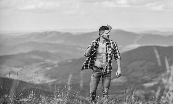 Discover sounds of nature. Musician hiker find inspiration in mountains. Peaceful hiker. Carefree wanderer. Conquer the peaks. Man hiker with guitar walking on mountain. Guy hiker enjoy pure nature - Foto, Bild