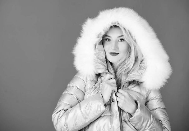 Confident in her style. woman in padded warm coat. beauty in winter clothing. cold season shopping. girl in hood. faux fur fashion. flu and cold. seasonal fashion. happy winter holidays. New year - Foto, Bild