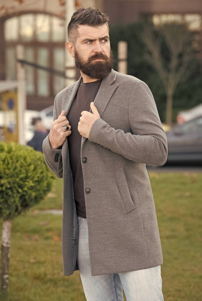 bearded hipster guy with stylish hairdo wear jacket and jeans for walking, fashion look - Zdjęcie, obraz