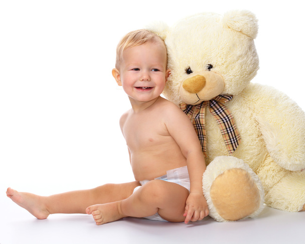 Happy child with big soft bear toy - Valokuva, kuva