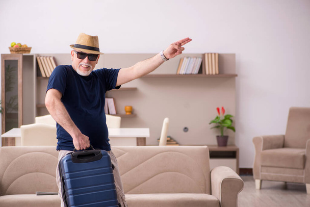 Old man preparing for trip at home - Foto, immagini