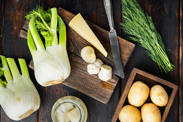 Artichoke with fennel, potato and parmesan ingredient, on old wooden table, flat lay - Photo, image
