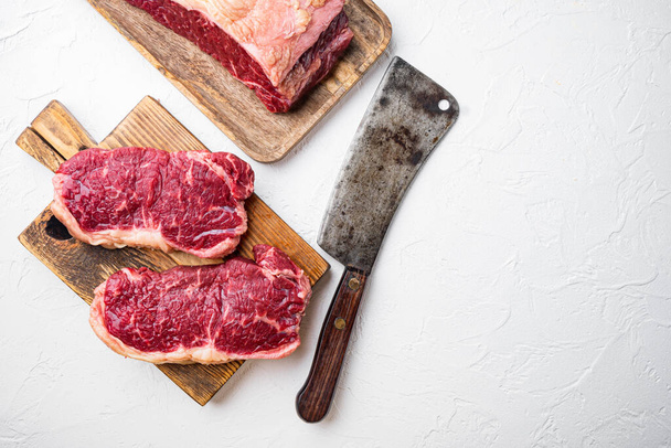 Short loin raw beef steak cut, on white background, top view, with copy space for text - 写真・画像