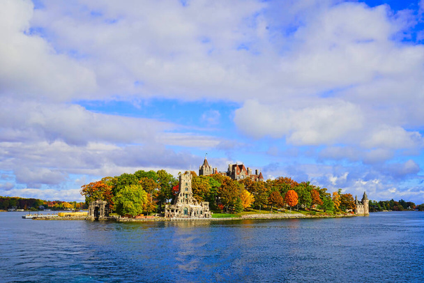 Historic Boldt Castle on Heart Island. Tree, leaves, river, blue sky.Autumn in the Thousand Islands at the St. Lawrence River. New York State, 2016.  - Photo, Image