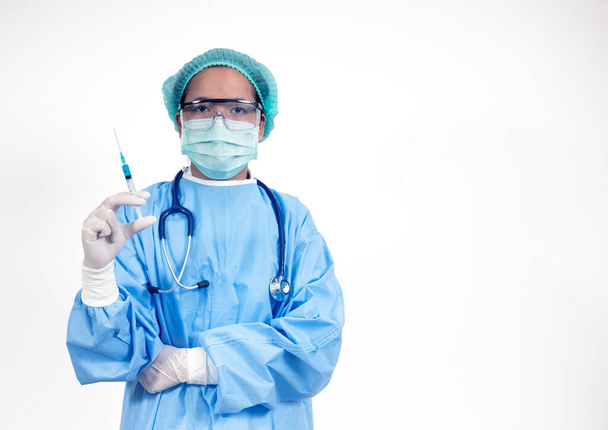 Doctor in surgical suite holding vaccine covid-19 syringe ,Coronavirus or Covid-19 outbreak concept - Photo, Image