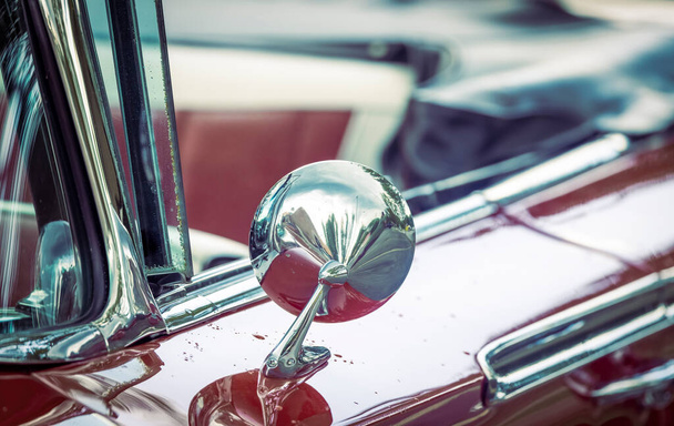 Close up shot of shiny side view mirror on a classic car - Фото, изображение