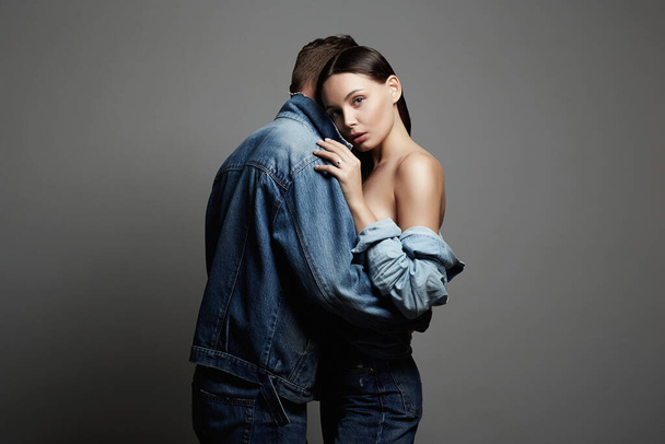 lovely beautiful couple. sexy woman and handsome man. boy and girl together. jeans style - Фото, зображення