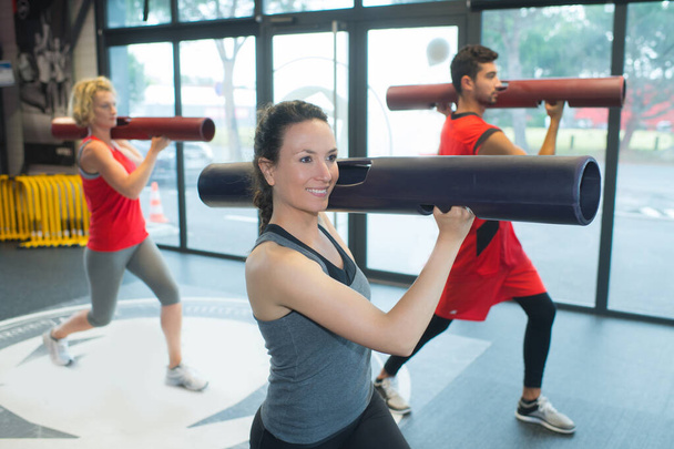 group exercising with long cylinder accessories - Photo, Image