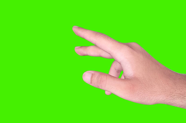 Gesto táctil de pantalla de mano con fondo de pantalla verde. Moderno joven mano tocando diseño de estilo - Foto, imagen