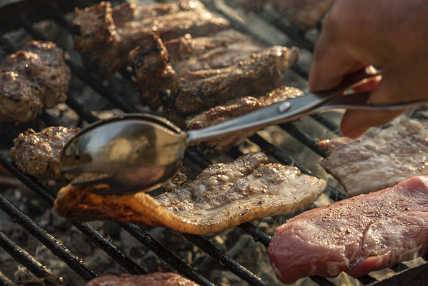 Grilled meat cook detail with smoke , cooking grilled meat - Photo, Image