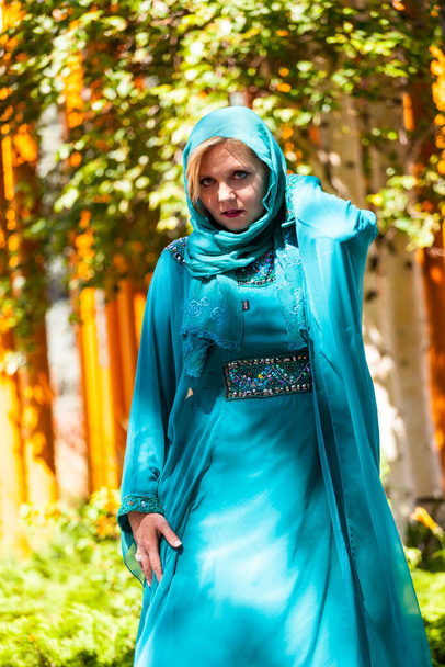 Calgary, Canada - August 10, 2014: Model showing Arab style fashion in public place at Olympic Plaza.  - Fotoğraf, Görsel