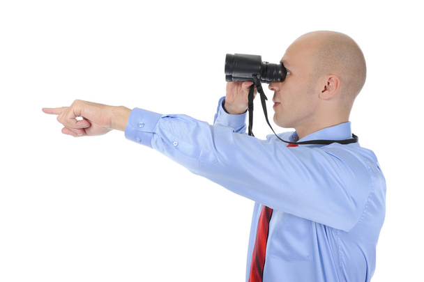 Image of a businessman looking up through binoculars. Isolated on white background - Foto, Imagem