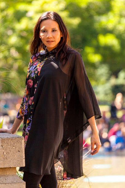 Calgary, Canada - August 10, 2014: Model showing Arab style fashion in public place at Olympic Plaza.  - Foto, afbeelding