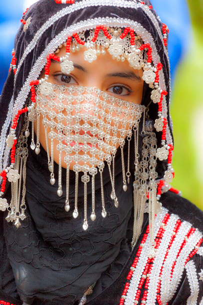 Calgary, Canada - August 10, 2014: Model showing Arab style fashion in public place at Olympic Plaza.  - Photo, image