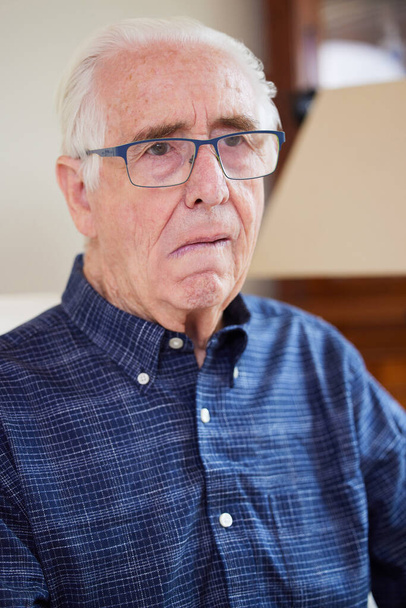 Portrait Of Senior Man At Home Suffering From Stroke Showing Dropped Side Of Face - Фото, зображення